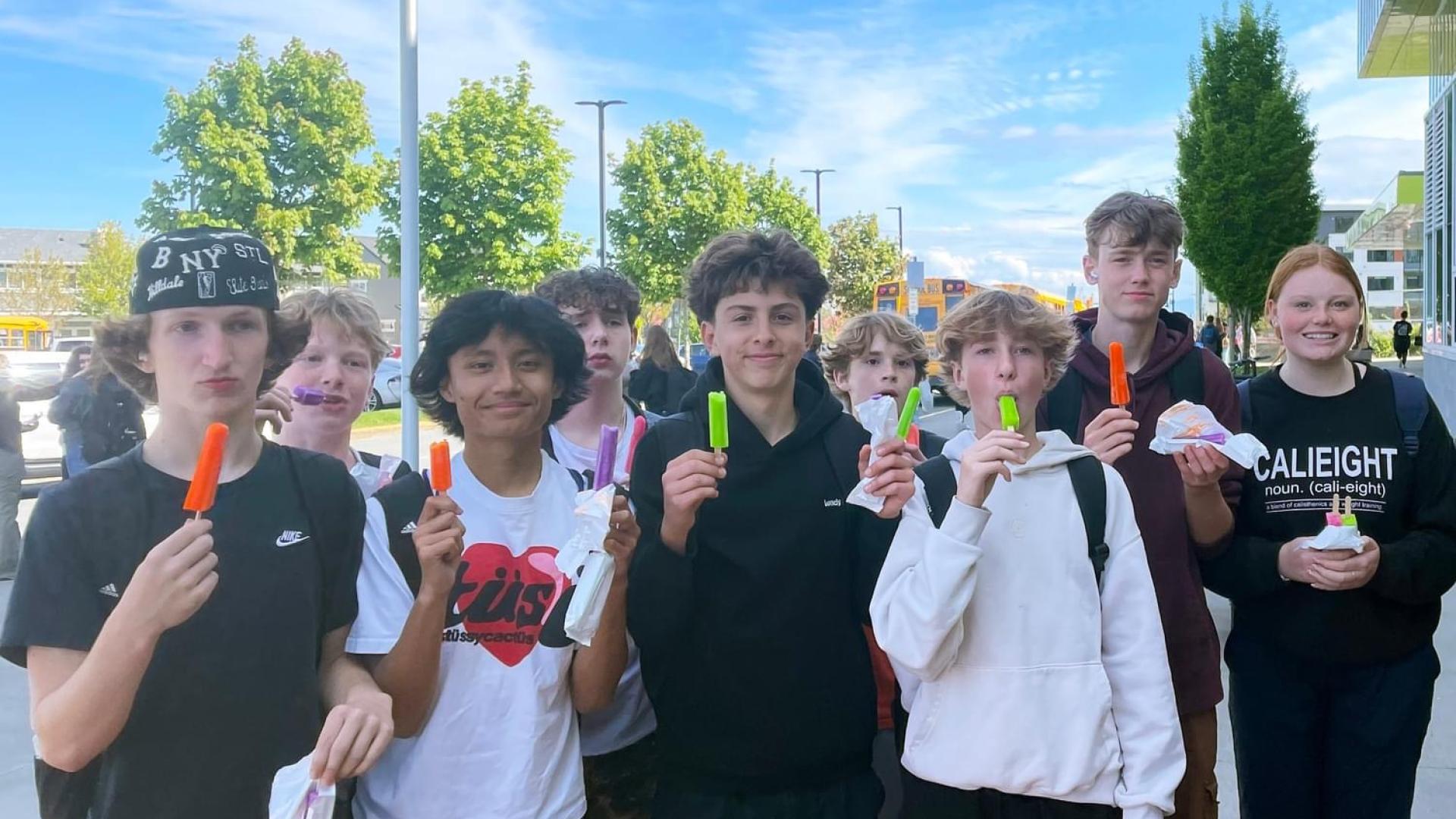 group of teen youth with popsicles