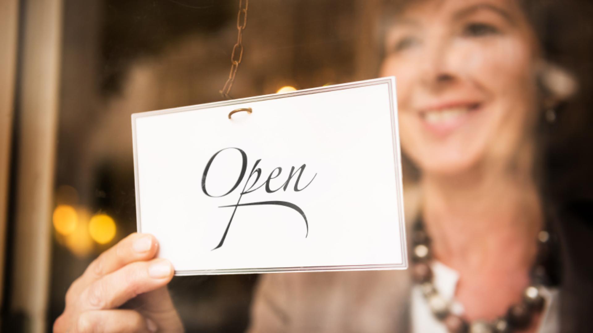 woman with open sign