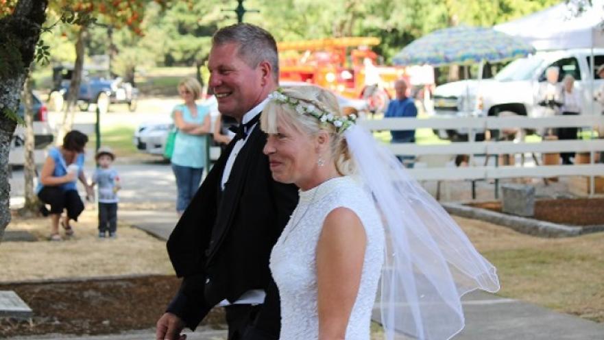 Bride and groom walking side-by-side.