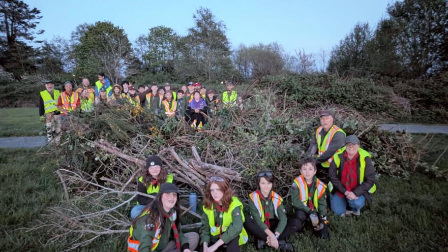 scouts pulling broom in the evening