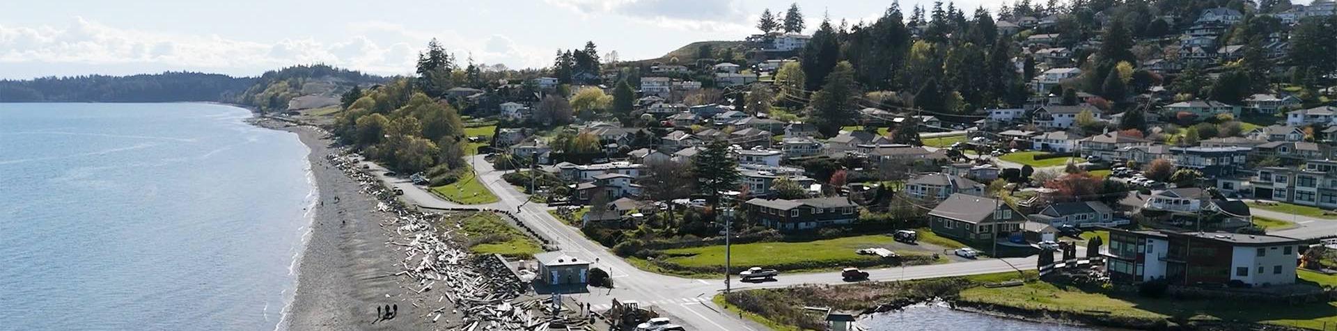 overhead view of the shore of the salish sea coburg peninsula ocean boulevard esquimalt lagoon and homes in colwood bc canada