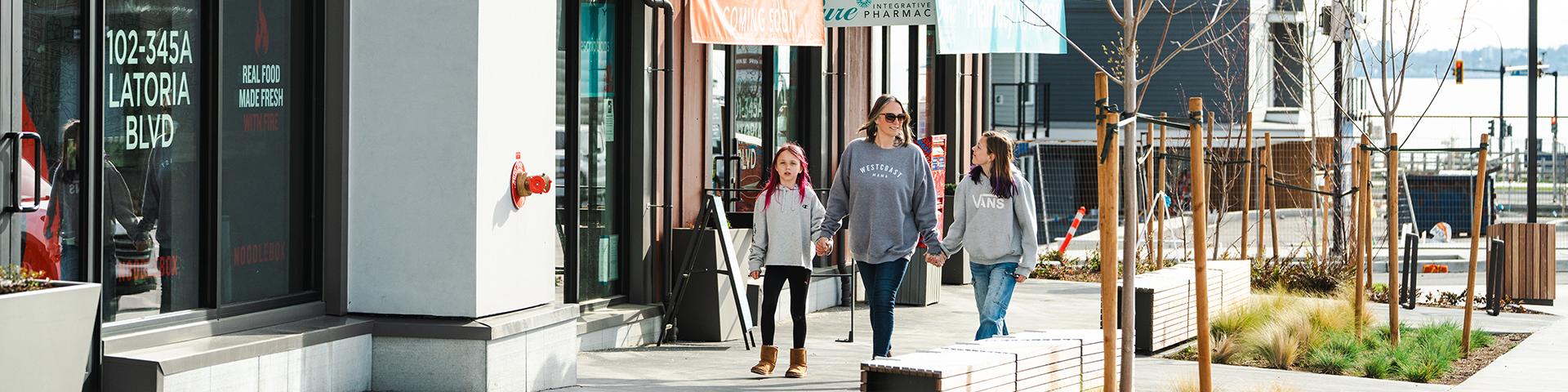 mom kids walking shopping commons