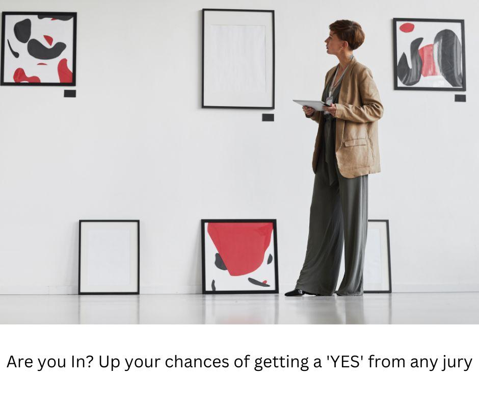 Woman holding a tablet, viewing framed abstract artwork displayed on a gallery wall, with the text 'Are you In? Up your chances of getting a 'YES' from any jury.'