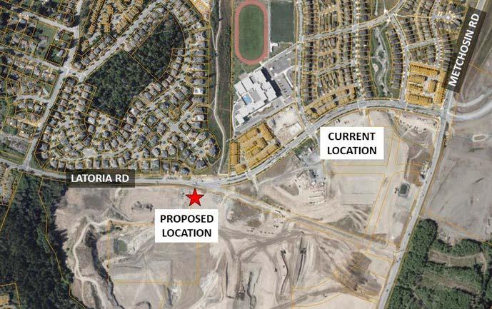 Aerial view showing a proposed location marked with a red star along Latoria Road. The current location is labeled to the northeast, near Metchosin Road. The area includes residential neighborhoods, a school with an athletic track, and open land, with roads and property boundaries clearly visible.